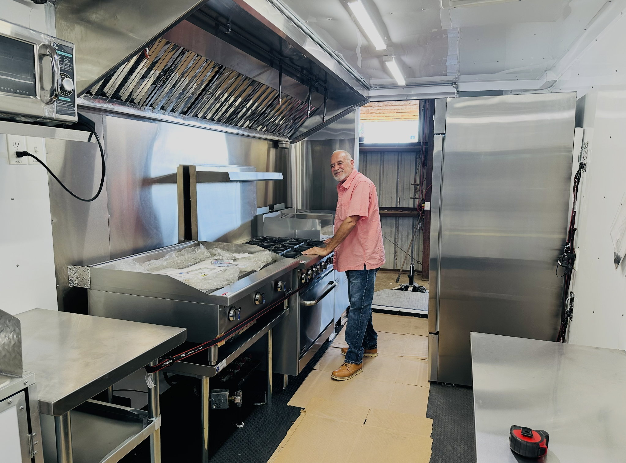Professional kitchen setup inside the food trailer